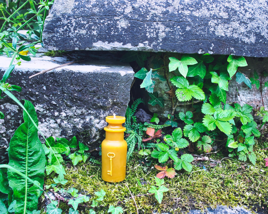 Small Round Potion Bottle with Tiny Skeleton Key